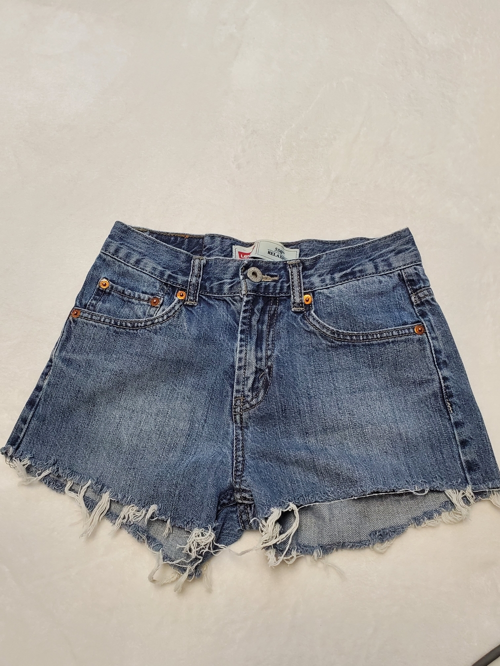 Levi's Medium Blue Frayed Hem Cutoff Denim Shorts